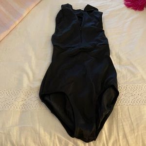 Black class in leotard with front zipper